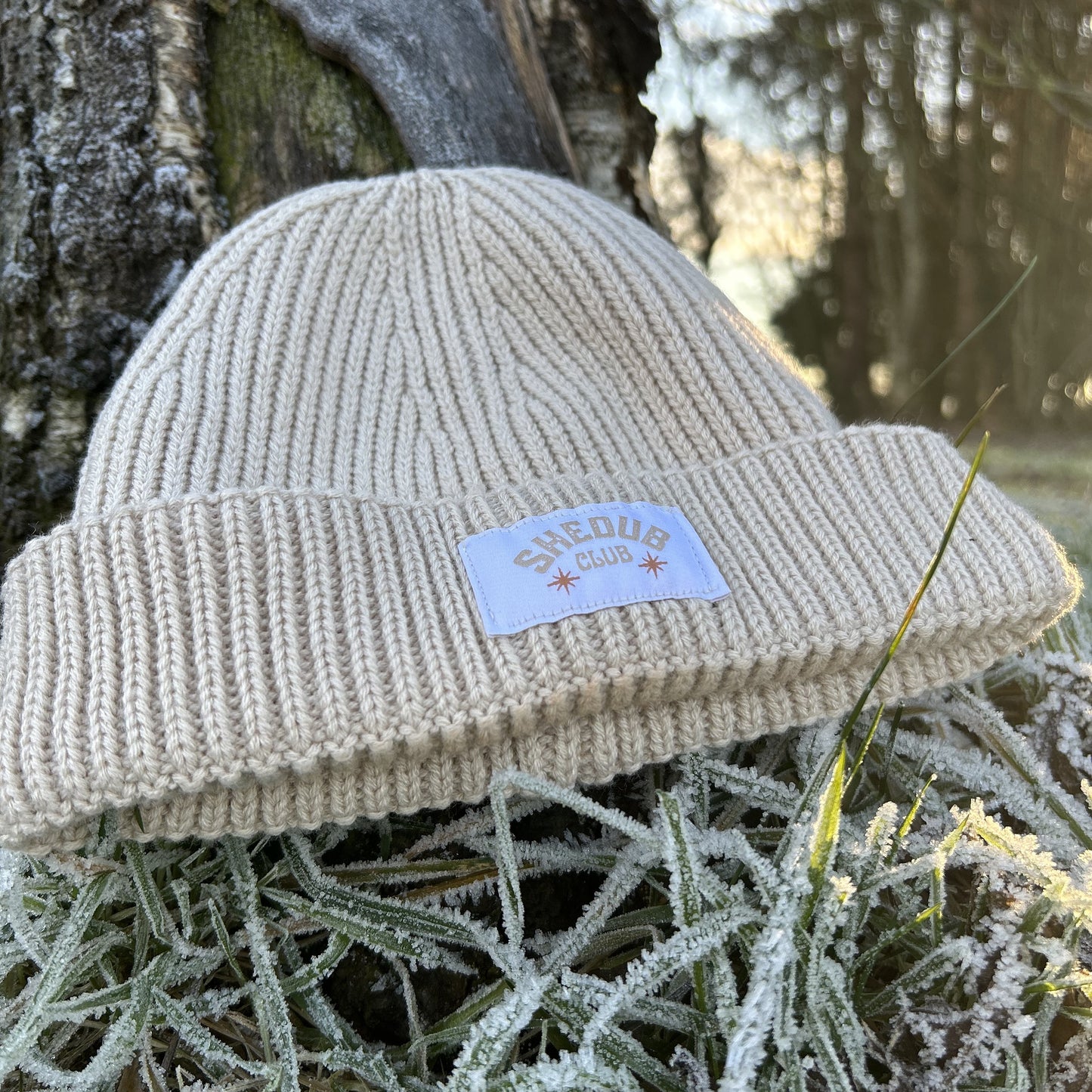 ribbed oatmeal colour beanie with embroidered shedub club 