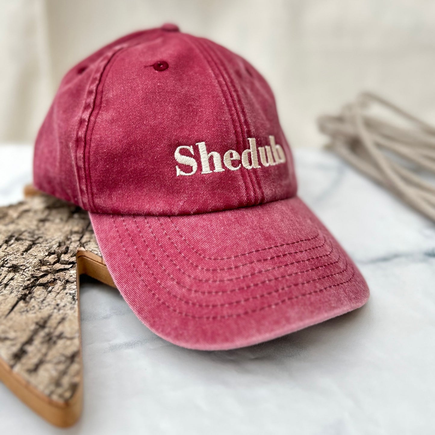 Vintage Red colour, Embroidered Shedub, low profile 6 panel, pre-curved peak Red stone wash look embroidered Shedub in beige on the front